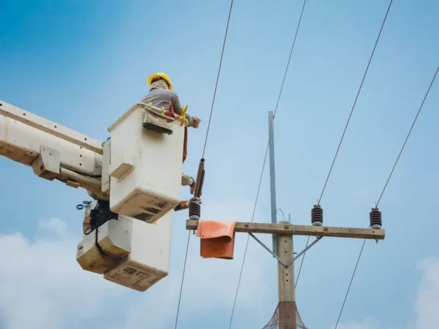 hydro utility lineman working from a truck mounted bucket lift